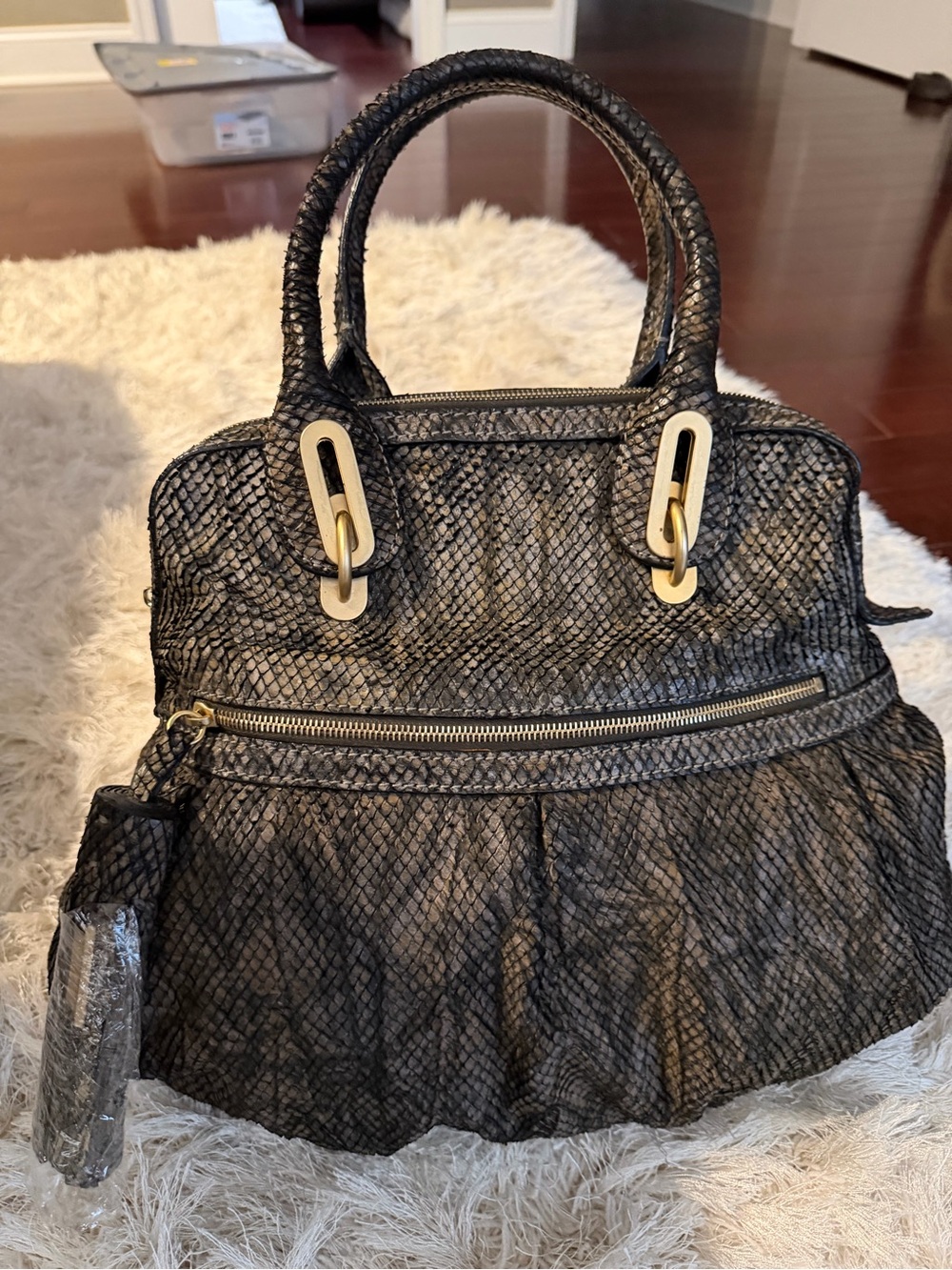 Stuart Weitzman Black Snake Ski. Leather Bucket Bag with Gold Accents